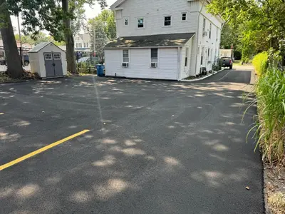 an empty street with a house and a building at Gem 1 Downtown Willoughby Historic District in Willoughby