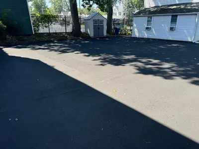 a shadow of a tree on a driveway at Downtown Willoughby Historic District Gem 3 in Willoughby