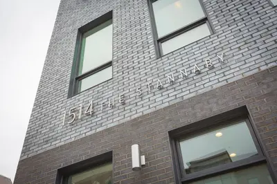 a brick building with a sign on the side of it at Unique contemporary 1600ft2 2BR 3BA apt OTR in Cincinnati
