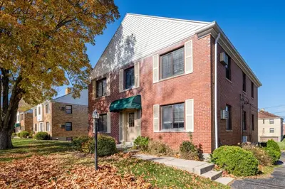 a red brick house with a white roof at Pet-Friendly Serenity Spot on Dorthy Lane in Dayton