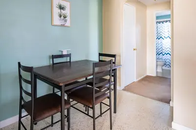 a dining room with a wooden table and chairs at Pet-Friendly Serenity Spot on Dorthy Lane in Dayton