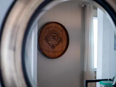 a wooden clock on a wall in a room at 3584 Blanche Ave in Cleveland Heights