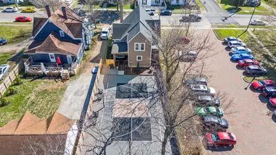 an aerial view of a house with cars parked in a parking lot at The Luxe/Pickleball/Basketball/ Hot Tub/Horse Park in Georgetown