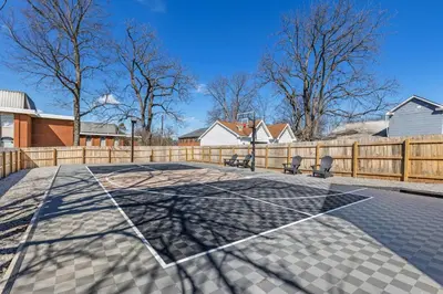 a tennis court with a net on top of it at The Luxe/Pickleball/Basketball/ Hot Tub/Horse Park in Georgetown