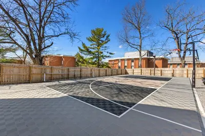 a basketball court with a fence and trees at The Luxe/Pickleball/Basketball/ Hot Tub/Horse Park in Georgetown