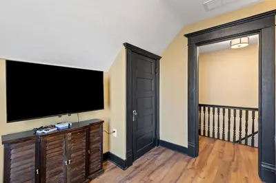 a living room with a large flat screen tv at The Luxe/Pickleball/Basketball/ Hot Tub/Horse Park in Georgetown
