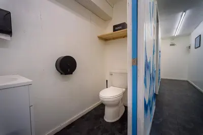 a bathroom with a toilet and a sink at Furnished Glamping Tent/River Access/2 Queen Beds in Stanton