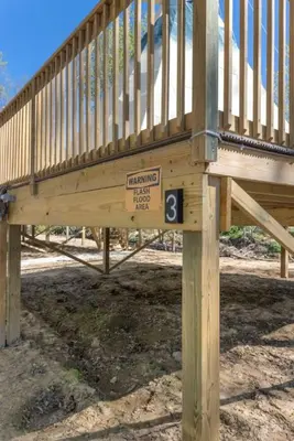 a wooden staircase with a sign on it at Furnished Glamping Tent/River Access/2 Queen Beds in Stanton