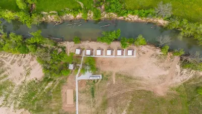 an aerial view of a house on an island in a river at Furnished Glamping Tent/Red River Access/King Bed in Stanton