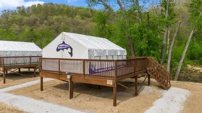 a yurt with a roof and a ramp in the sand at Furnished Glamping Tent/River Access/2 Queen Beds in Stanton