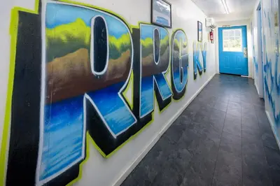 a hallway with graffiti on the wall at Glamping Tent/Red River Access/2 Queen Beds in Stanton