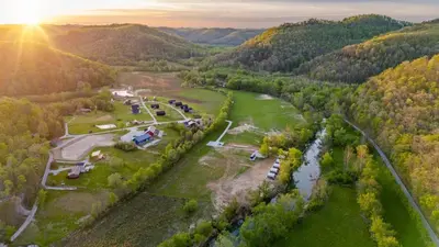 an aerial view of a park with a river at Glamping Tent/Red River Access/2 Queen Beds in Stanton