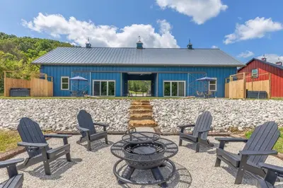 a blue building with chairs and a table in front of it at New Barndo/King Beds/Hot Tub/Ample Level Parking in Stanton
