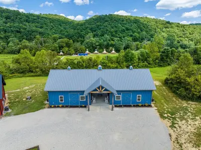 an overhead view of a blue barn with a driveway at New Barndo/King Beds/Hot Tub/Ample Level Parking in Stanton