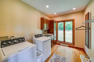 a laundry room with a washer and dryer and a window at Rural and Private Dover Retreat Close to Wineries! in Dover