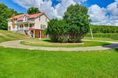 a house with a tree and a driveway at Rural and Private Dover Retreat Close to Wineries! in Dover