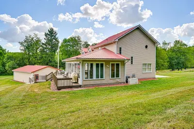 a small house on a grassy field at Rural and Private Dover Retreat Close to Wineries! in Dover