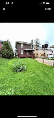 a house with a yard with green grass at Southern Charm Private Queen Bedroom Suite 2 in Cincinnati