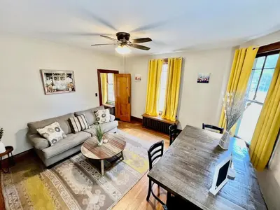 a living room with a couch and a table at Southern Charm Private Queen Bedroom Suite 2 in Cincinnati