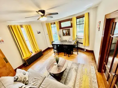 a living room with a couch and a table at Southern Charm Private Queen Bedroom Suite 2 in Cincinnati