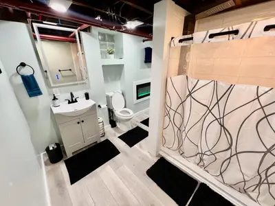 a bathroom with a toilet and a sink at Southern Charm Private Queen Bedroom Suite 2 in Cincinnati
