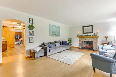 a living room with a couch and a fireplace at 4 Mi to Main Street! Family Getaway in Zanesville in Zanesville