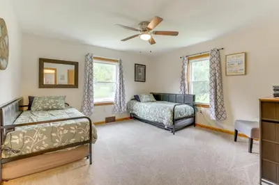 a bedroom with two beds and a ceiling fan at 4 Mi to Main Street! Family Getaway in Zanesville in Zanesville