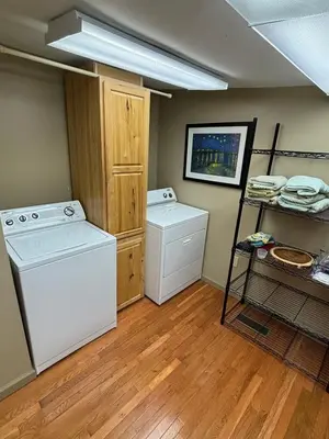 a laundry room with a washer and dryer at House Upon a Hill in Newton Falls