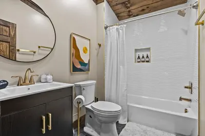 a bathroom with a toilet and a sink and a shower at New/12 Guest /2 Hot Tubs/ 2 Kitchens/ 2 Firepits in Stanton