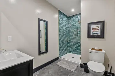 a bathroom with a sink and a toilet and a shower at New Barn/King Beds/Hot Tub/Spacious Level Parking in Stanton