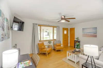 a living room with a couch and a ceiling fan at Steps to Lake Erie! Cedar Point Home Base with Deck in Sandusky