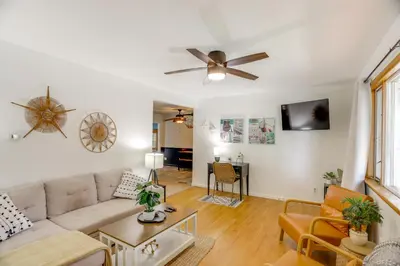 a living room with a couch and a ceiling fan at Steps to Lake Erie! Cedar Point Home Base with Deck in Sandusky