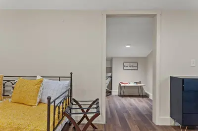 a bedroom with a bed and a desk in a room at Barndo/Ample Parking/Access to Red River/Hot Tub in Stanton