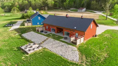 an overhead view of a red and blue house at Barndo/Ample Parking/Access to Red River/Hot Tub in Stanton