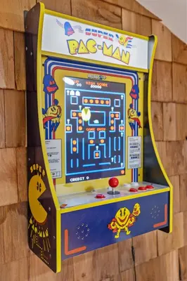 a colorful rc man arcade game on a wall at New Barndo/Red River Access/King Beds/Hot Tub in Stanton