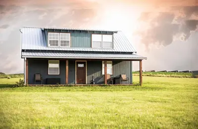 a house in the middle of a field at Little house on the prairie