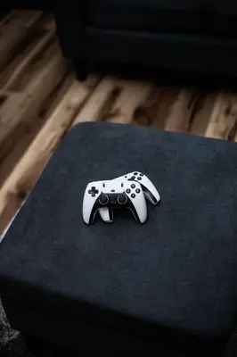 a video game controller sitting on top of a table at Little house on the prairie
