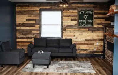 a living room with a couch and a window at Little house on the prairie