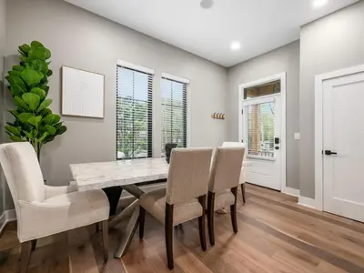 a dining room with a table and chairs at New Build OSU Short North Dtown in Columbus