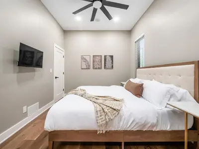 a bedroom with a bed and a ceiling fan at New Build OSU Short North Dtown in Columbus
