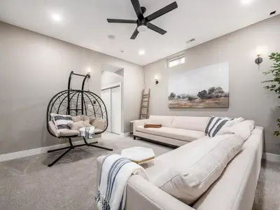 a living room with a couch and a chair at New Build OSU Short North Dtown in Columbus