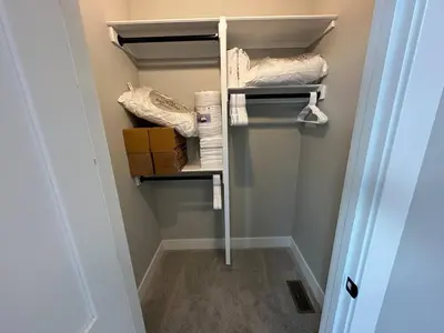 a walk in closet with towels and boxes at New Build, Downtown Views, next to NCH in Columbus