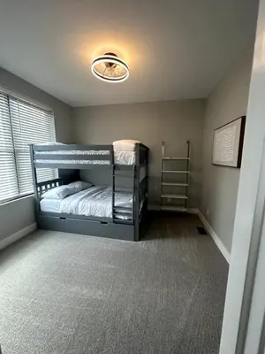 a bedroom with two bunk beds and a window at Brand NEW Build, D-Town Views, must See in Columbus