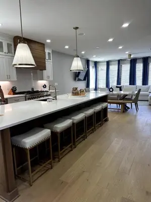 a kitchen with a counter and some bar stools at Brand NEW Build, D-Town Views, must See in Columbus
