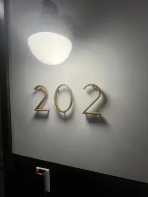 a wall with two gold rings on a wall at The Produce Suites in Toledo