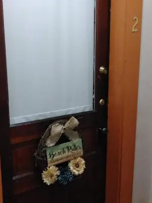 a door with a sign that reads health radio at The Historic Hideaway in McConnelsville