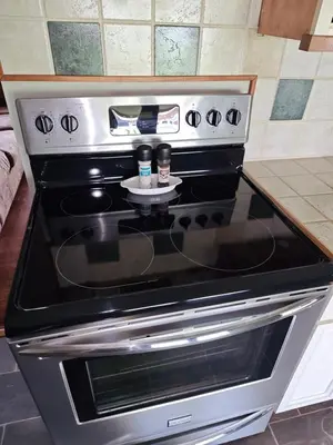 a stove in a kitchen with two cups on it at Pointer Palace in South Point
