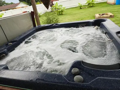 a jacuzzi tub in the backyard of a yard at Pointer Palace in South Point