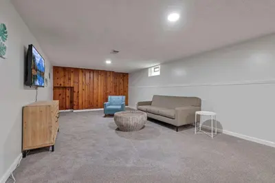 a living room with a couch and a tv at Spacious 4BR Ranch Near Easton Perfect for Families & Work Groups in Columbus