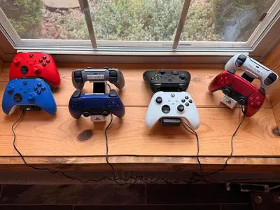 a group of consoles and controllers sitting on a table at Secluded, Luxuriously Remodeled, Gaming, Hot Tub! in South Bloomingville